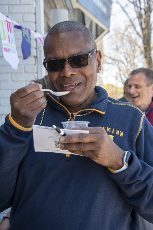 Michael Skinner enjoys a cup of gumbo on the stroll.